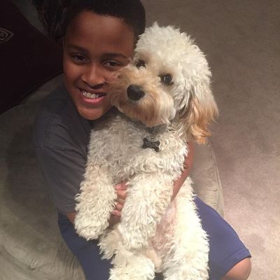 Picture of James Poyser's son Jadyn Poyser and his dog.
